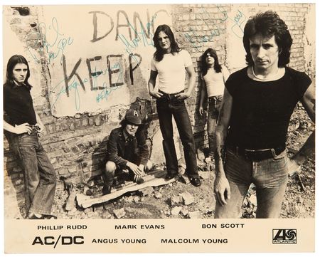 Lot #708 AC/DC Early Signed Publicity Photograph (ca. 1976) - Image 1