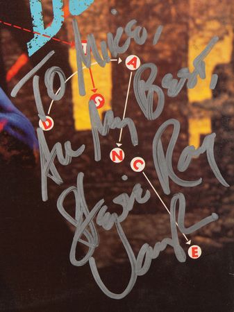 Lot #831 Stevie Ray Vaughan Signed Album - Let's Dance by David Bowie - Image 2