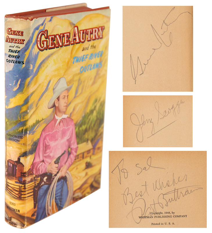 Lot 555 Gene Autry and Pat Buttram Signed Book - Gene Autry and the Thief River Outlaws