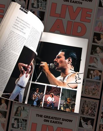 Lot #3588 Live Aid Multi-Signed Book with Queen, David Bowie, Elton John, and (20+) Musical Acts - Image 1
