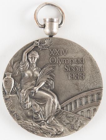 Lot #3093 Seoul 1988 Summer Olympics Silver Winner's Medal for Women's Basketball - Image 1
