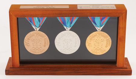Lot #3092 Calgary 1988 Winter Olympics Gold, Silver, and Bronze Winners' Medals Display - Image 4