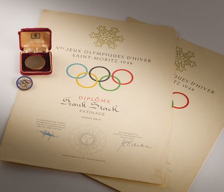 Lot #3131 St. Moritz 1948 Winter Olympics Bronze Participation Medal, Competitor's Badge, and (2) Diplomas - From the Collection of Canadian Speed Skater Frank Stack - Image 1