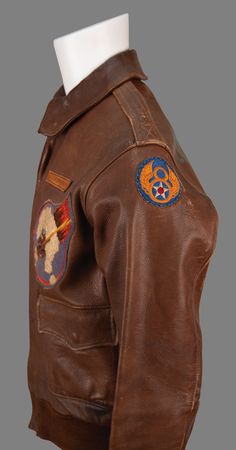 Lot #49 World War II: William F. Stuckey’s B-24 'The Dreamer' A-2 Bomber Jacket and (30) Mission-Used Bomb Fuse Pins with Military Archive Including Award Citations, Photographs, and Patches - Image 4
