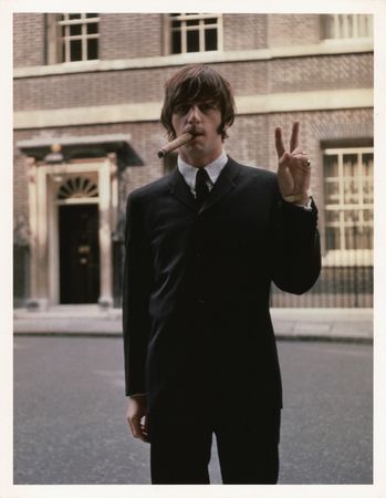 Lot #7083 Ringo Starr Photographic Print by Terry O'Neill - Cigar and Peace Sign at 10 Downing Street - Image 1
