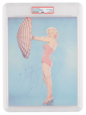 Lot #632. Marilyn Monroe Signed Photograph - Rare Color Bathing Suit Portrait