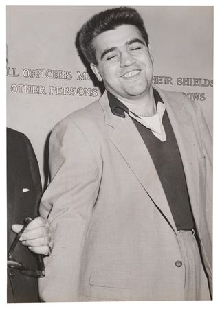Lot #458 Vincent 'The Chin' Gigante Oversized 1957 Press Photo, Following His Arrest for the Attempted Murder of Frank Costello - Image 1