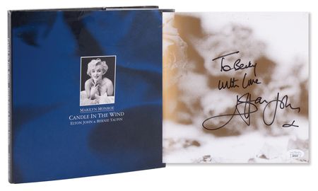 Lot #614. Elton John Signed Book - Marilyn Monroe: Candle in the Wind