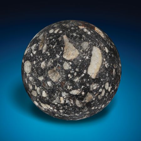 Lot #6478 NWA 12691 — Lunar Meteorite Rendered as a 1.5˝ Sphere - Image 2
