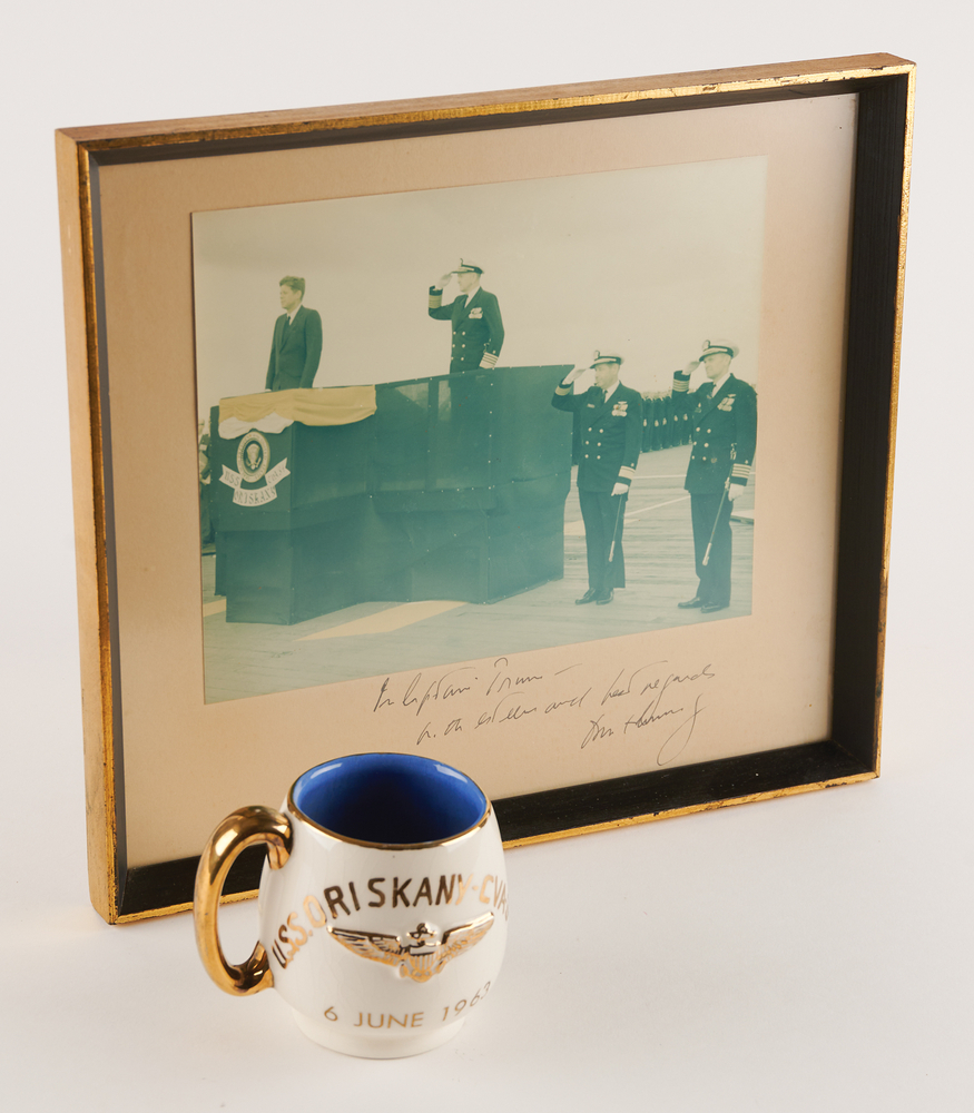 Lot 93 John F. Kennedy Signed ‘USS Oriskany’ Photograph as President, with Commemorative ‘Presidential Visit’ Mug