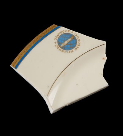 Lot #7015 Hindenburg Disaster: Original Ticket, Radiogram, Wine Menu, and Zeppelin China Fragment Recovered from Wreckage - Image 3